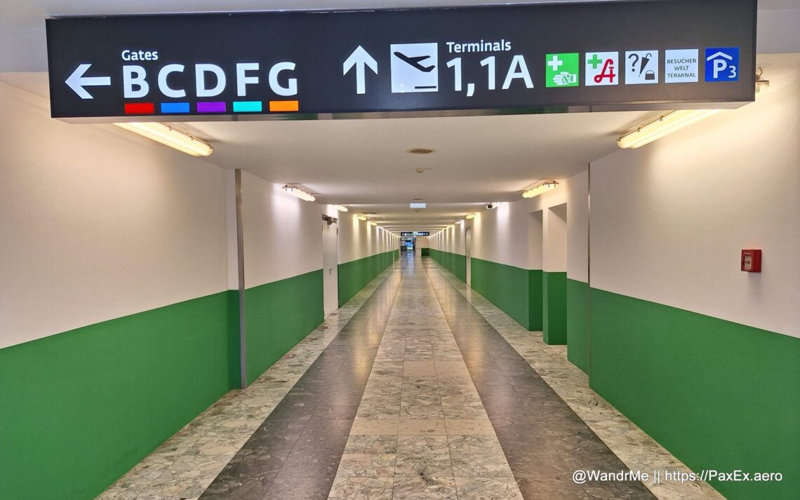 a long hallway with signs and arrows