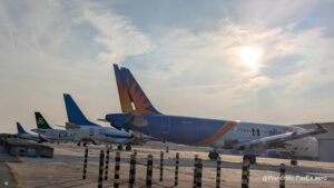 Busted planes on the ground, stripped of parts as part of their demise.
