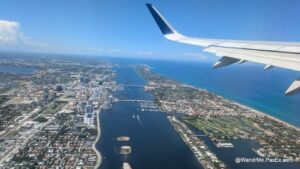 window view flying over an intercoastal waterway and beach area