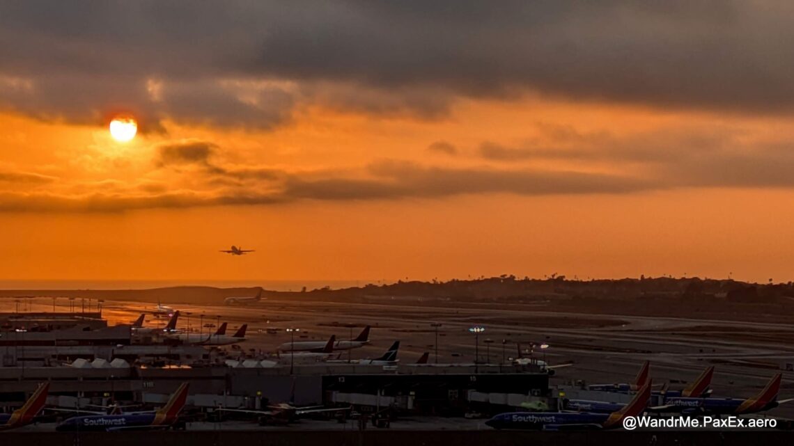 plane taking off into an orange sunset at LAX