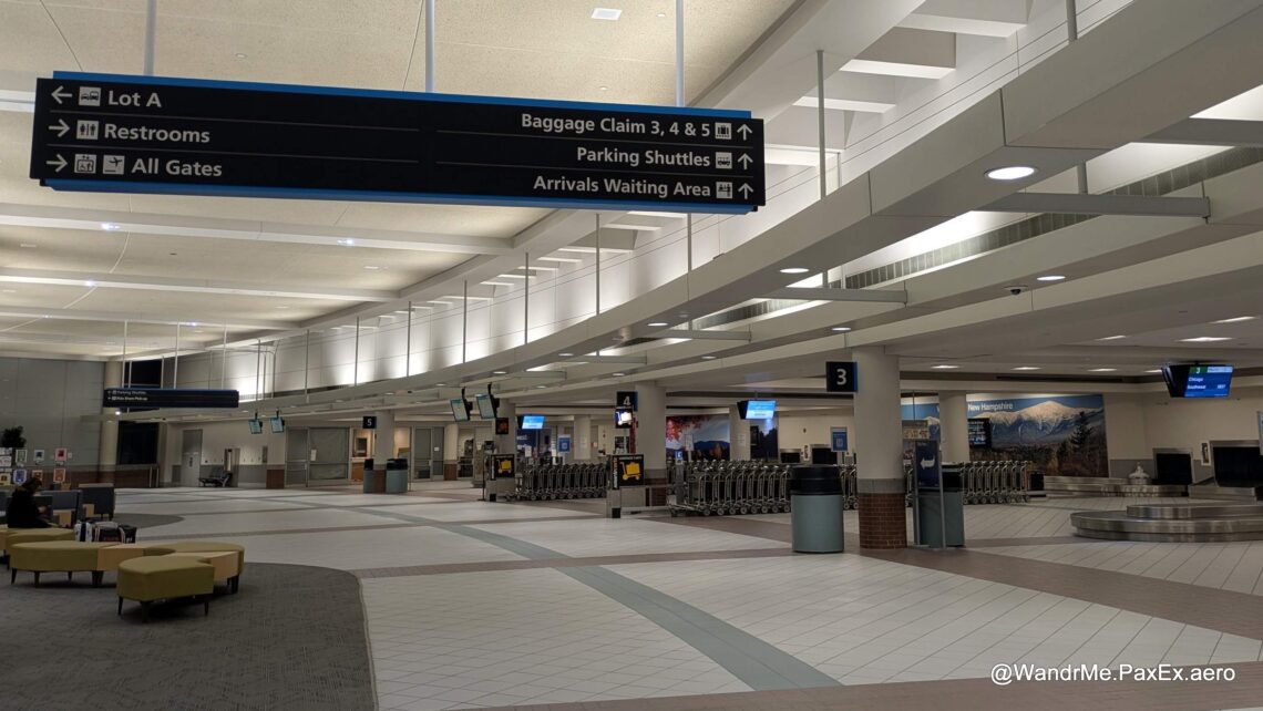 an empty baggage claim area at an airport