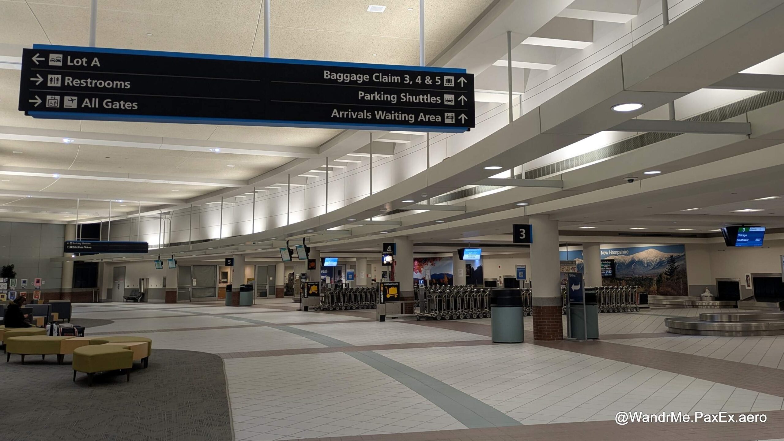 an empty baggage claim area at an airport