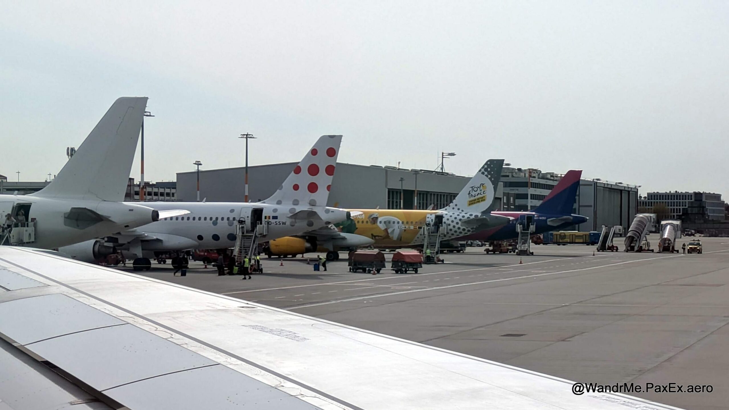 plane tails at an airport.