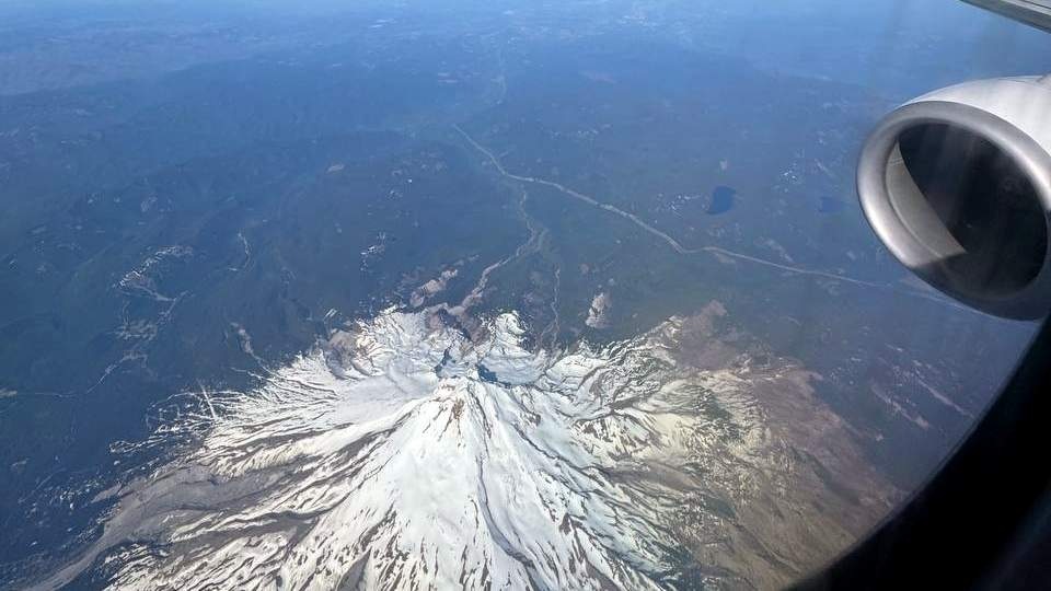 flying over a snow-covered mountain