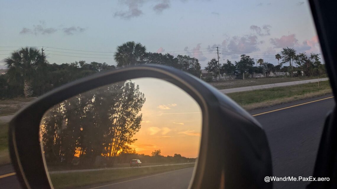 sunset in a car rearview mirror