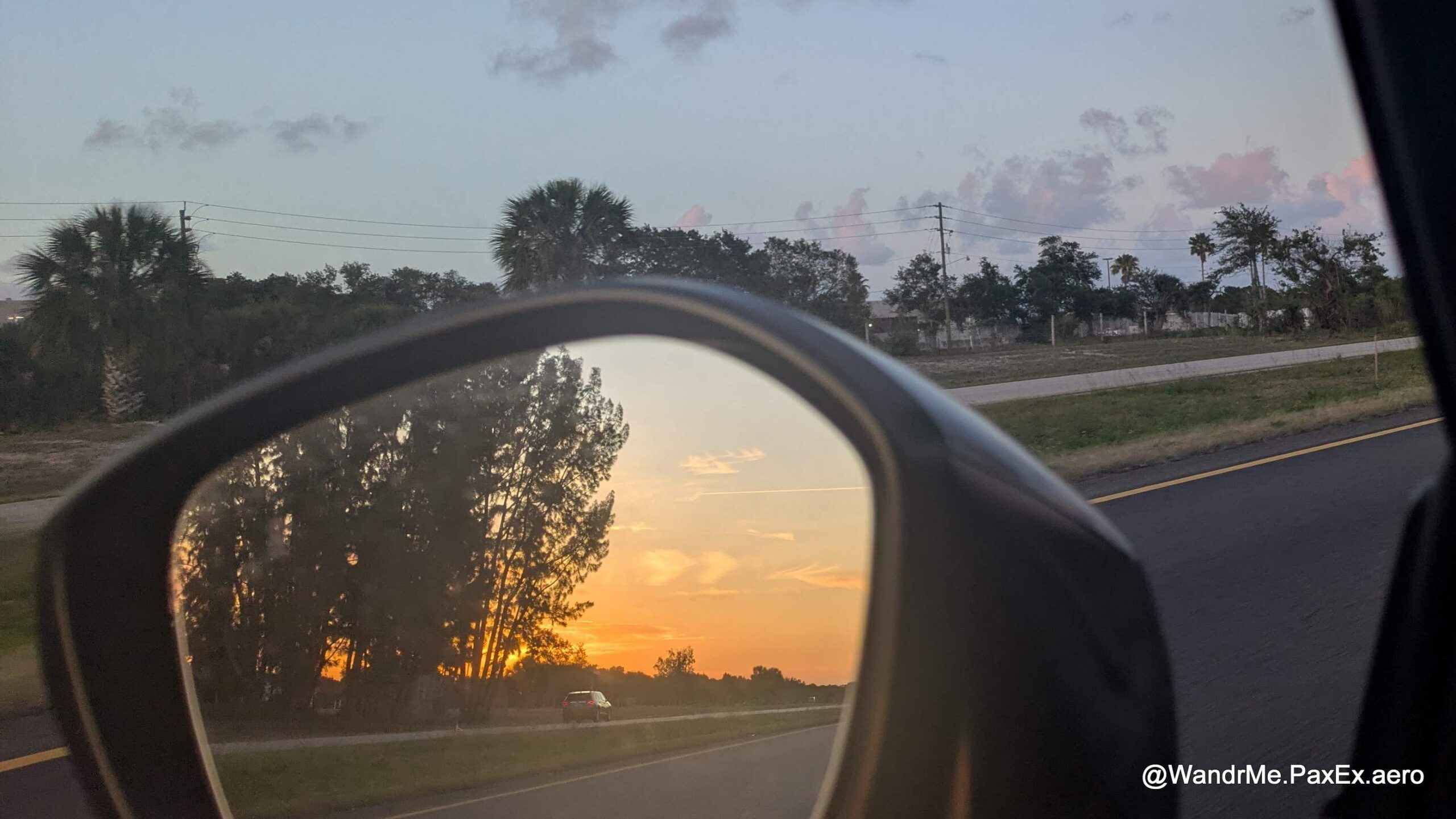 sunset in a car rearview mirror