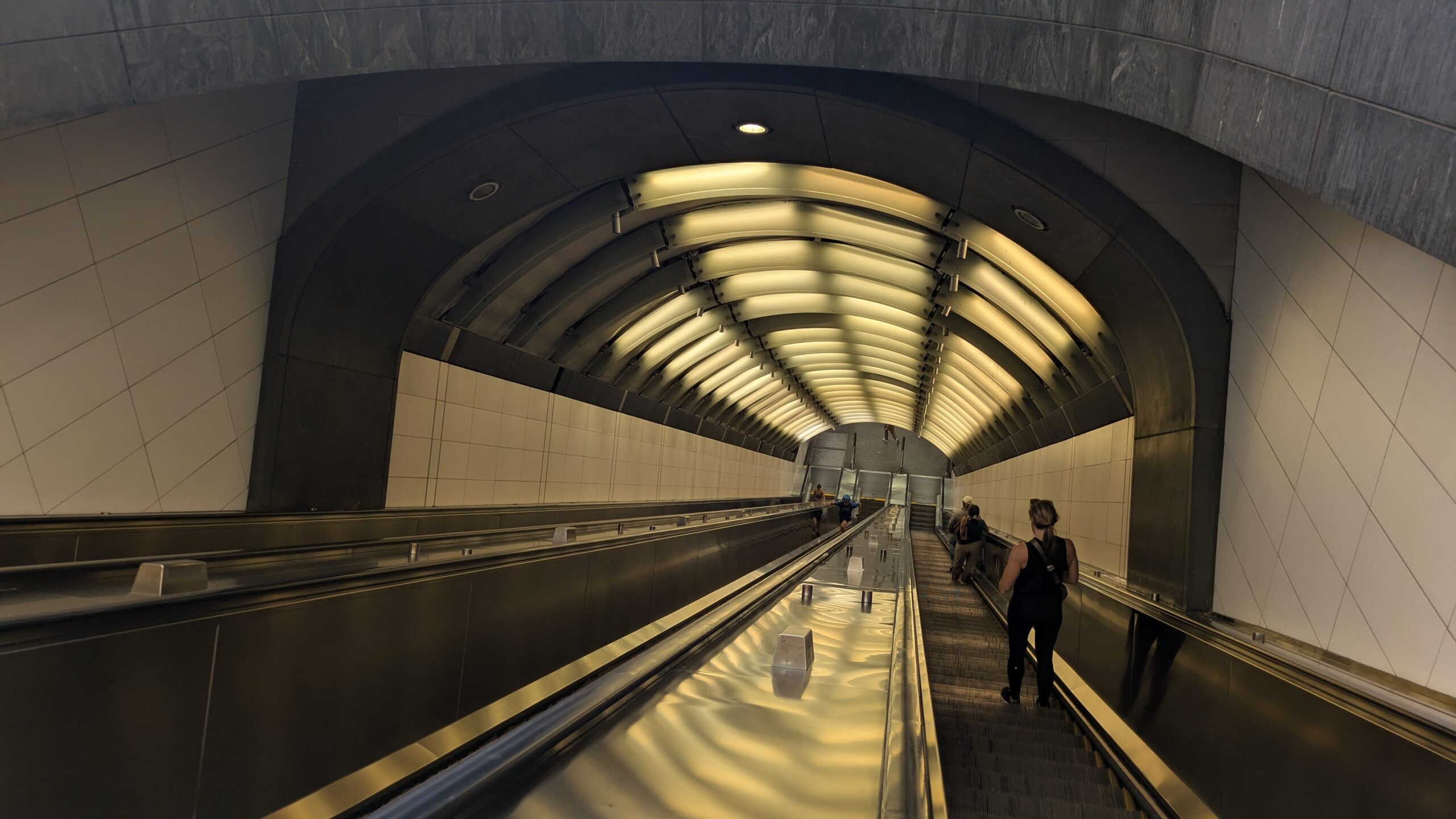 Escalators descending into a subway station