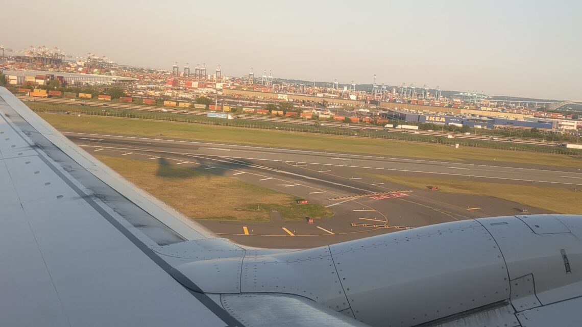 Shadow of a plane as seen from the window of that plane as it takes off.